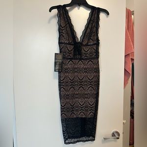 BEBE Women’s black lace up midi dress